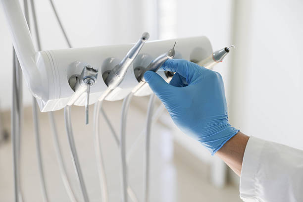 Professional Tooth Extraction technician working in Alpharetta, GA